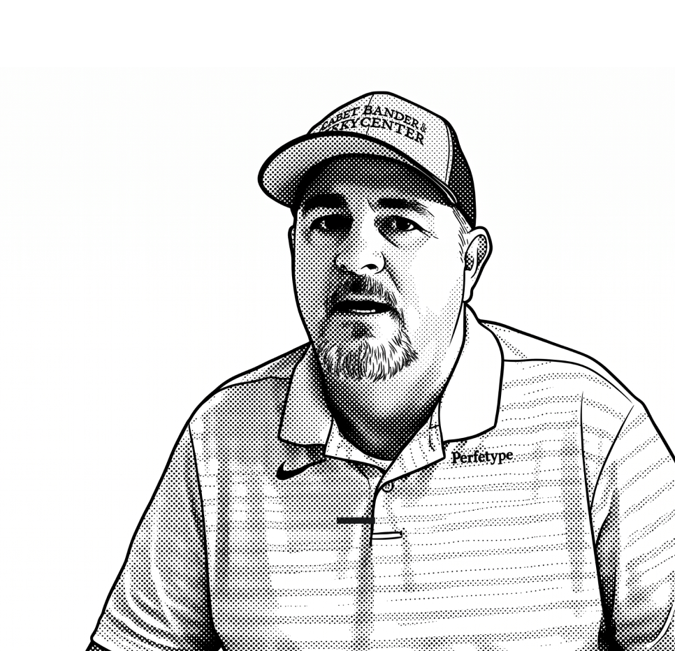 A man with a goatee wearing a baseball cap and a collared shirt sits facing forward. The shirt has “Perletype” written on it, and the hat has text that is partially readable. The image is in a black-and-white illustrated style.
