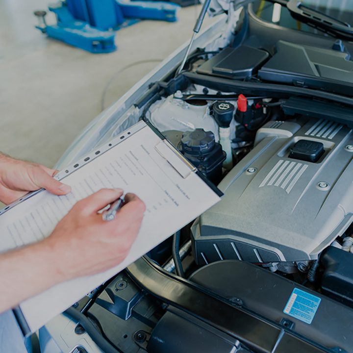 Mechanic writing on a keyboard