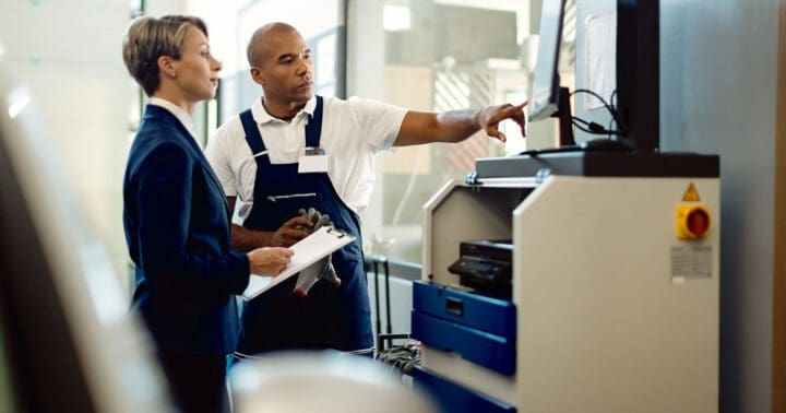 automotive service technicians on a computer