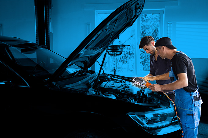 automotive service technicians working on a vehicle|automotive service technician